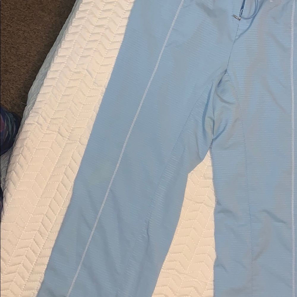 Light blue Nike track suit pants